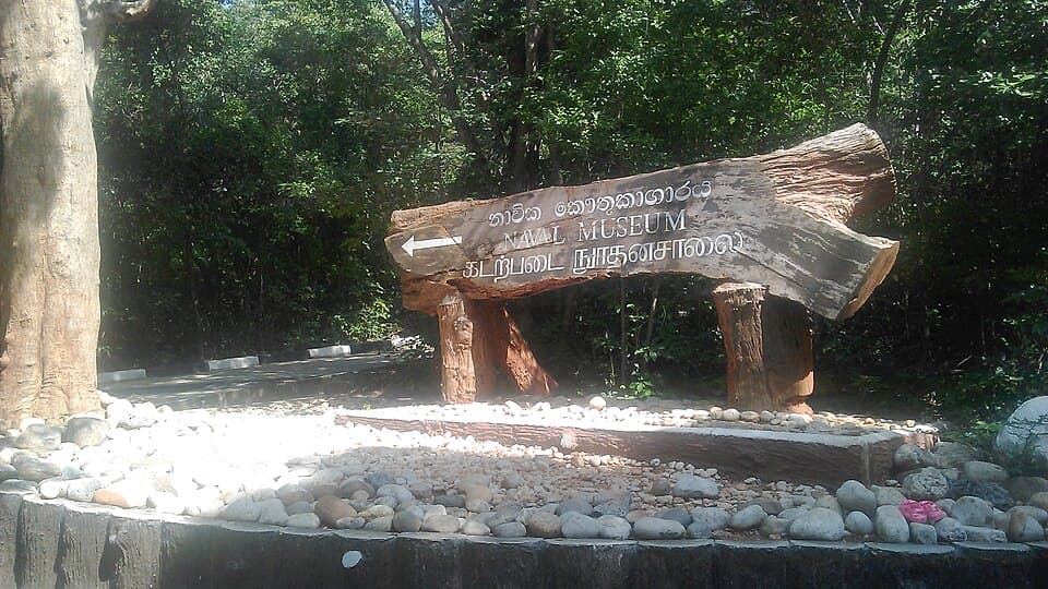 The carved wooden signpost to the Hoods Tower naval museum inside Trincomalee dockyard