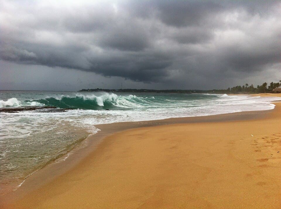 Waves breaking on Medaketiya Beach, east of Tangalle, under a storm sky