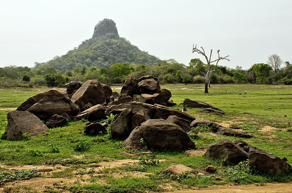 Thoppigala rock rising above the plain and boulders northwest of Batticaloa