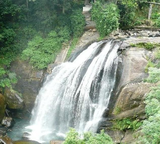 Huluganga Falls dropping into a natural pool near Huluganga town in Kandy District